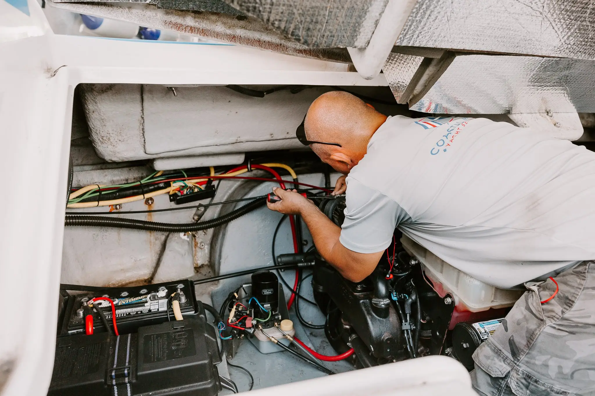 Technician diagnosing marine mechanical equipment